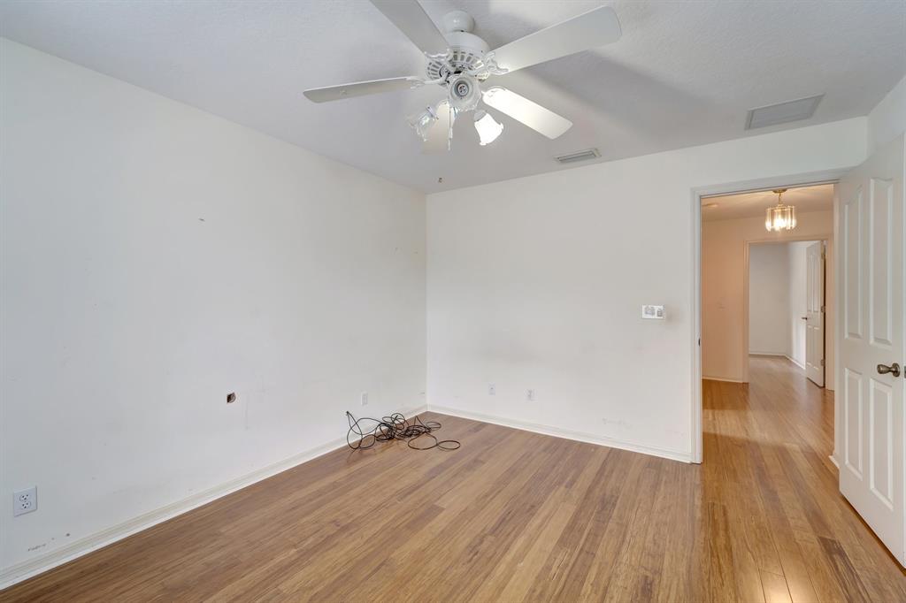 8040 Conservatory Circle Sarasota, FL 34243 - Photo 17 of 52 wooden floor in an empty room with a window