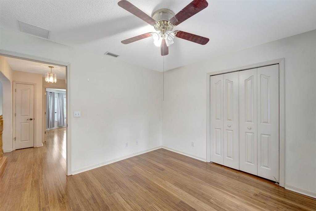 8040 Conservatory Circle Sarasota, FL 34243 - Photo 24 of 52 a view of an empty room with wooden floor