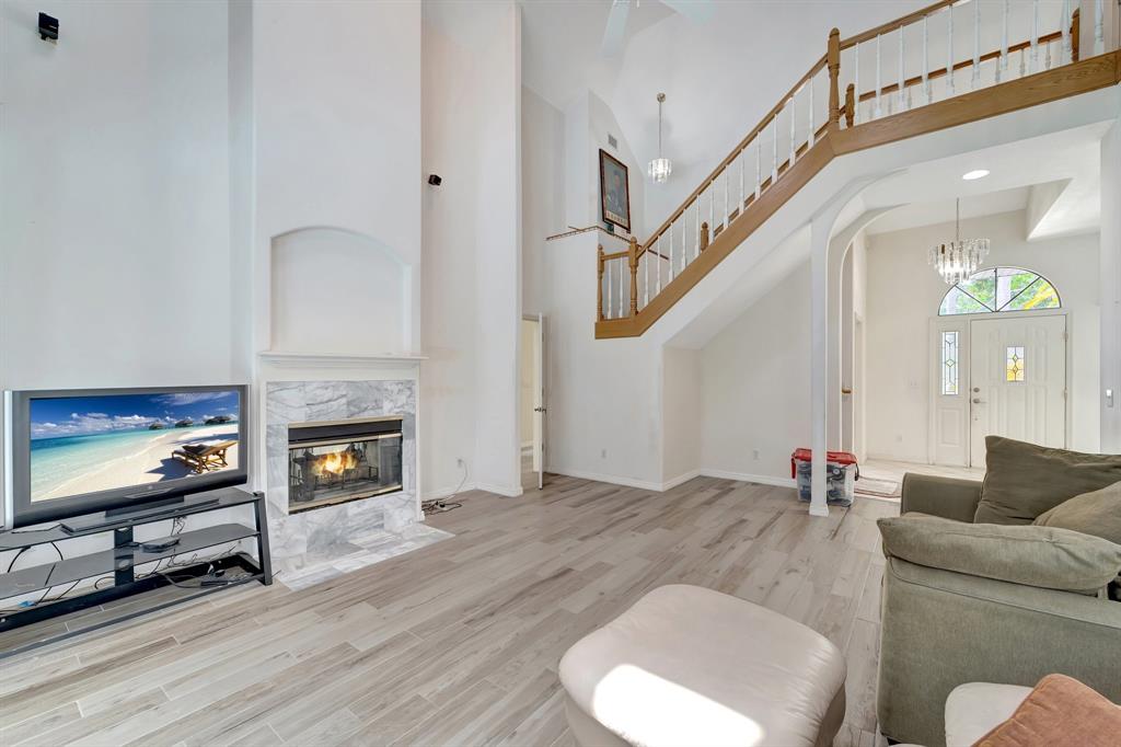 8040 Conservatory Circle Sarasota, FL 34243 - Photo 30 of 52 a living room with furniture and a flat screen tv