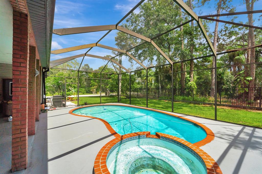 8040 Conservatory Circle Sarasota, FL 34243 - Photo 38 of 52 a view of a backyard with swimming pool