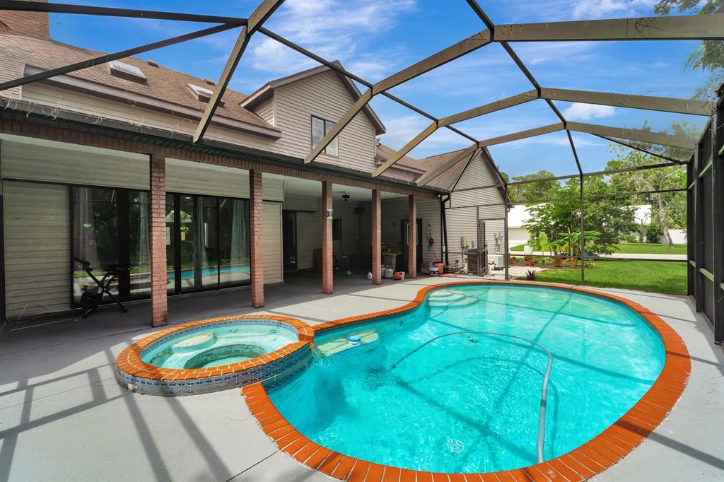 8040 Conservatory Circle Sarasota, FL 34243 - Photo 40 of 52 a view of a swimming pool with a patio