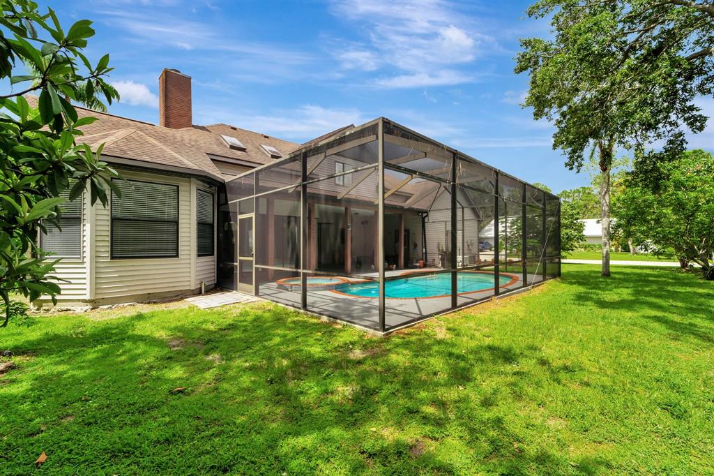 8040 Conservatory Circle Sarasota, FL 34243 - Photo 42 of 52 a view of a house with a yard and sitting area