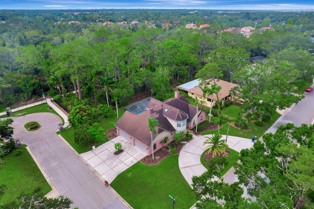8040 Conservatory Circle Sarasota, FL 34243 - Photo 47 of 52 an aerial view of residential house with outdoor space and trees all around