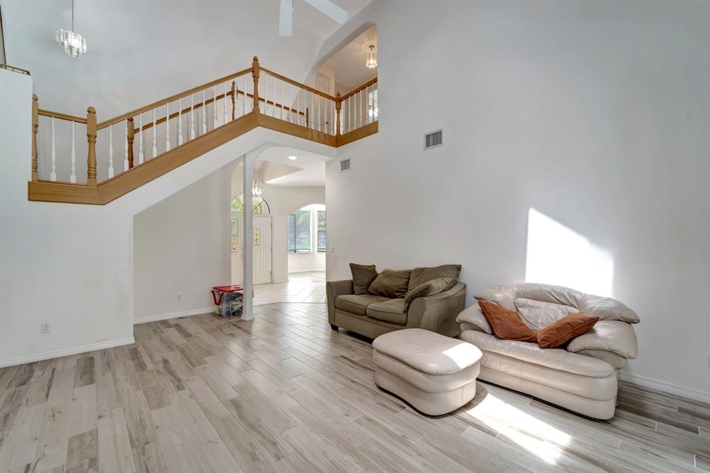 8040 Conservatory Circle Sarasota, FL 34243 - Photo 6 of 52 a living room with furniture and a wooden floor
