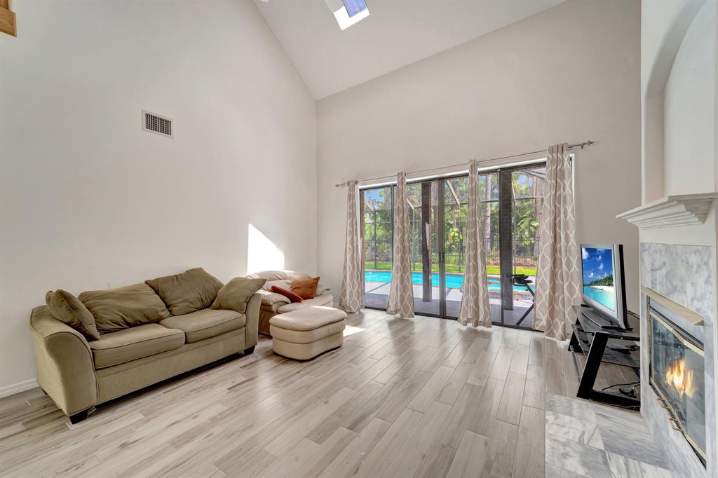 8040 Conservatory Circle Sarasota, FL 34243 - Photo 8 of 52 a living room with furniture and a flat screen tv
