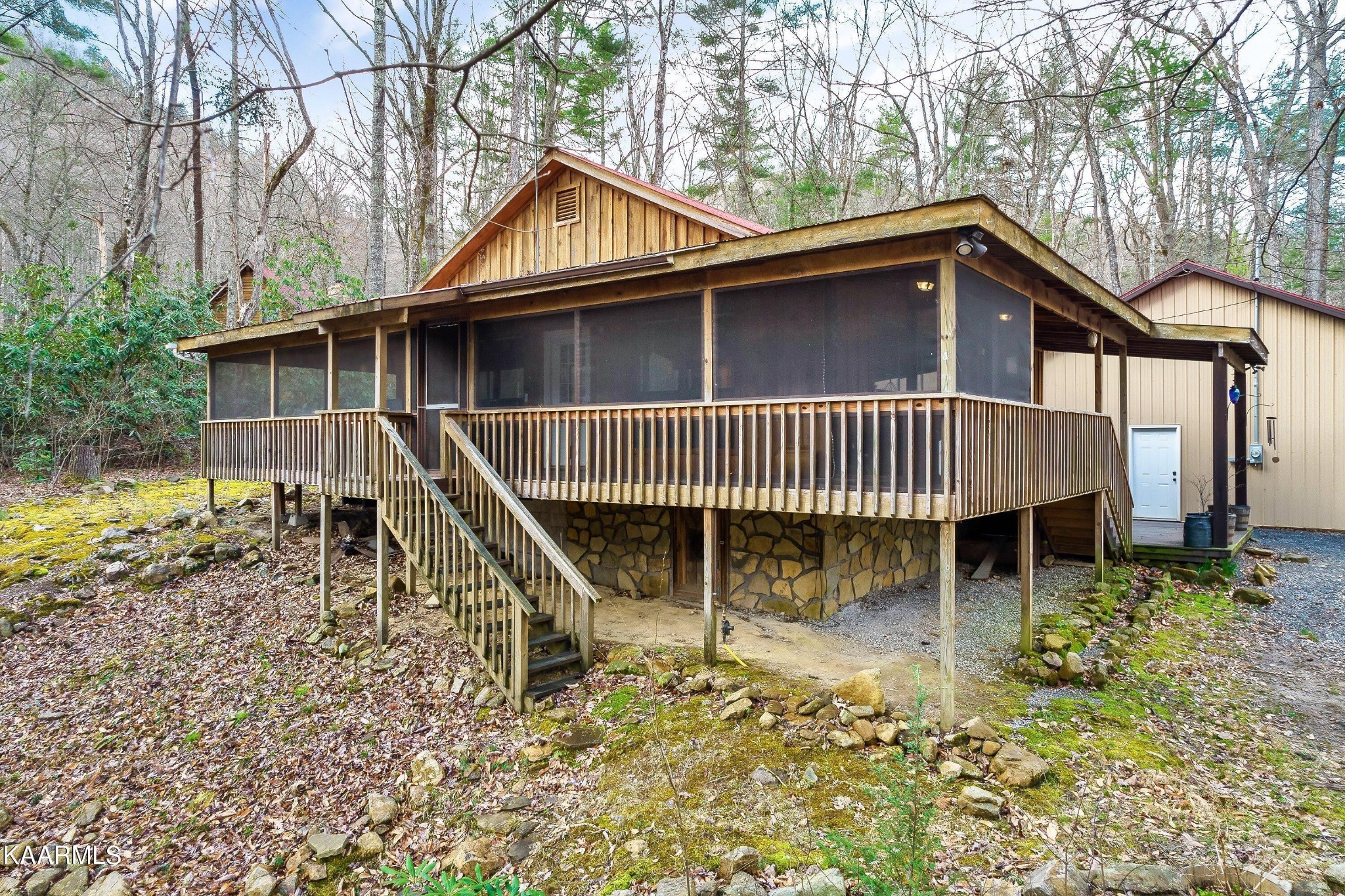 3390 Rocky Ridge Road Cosby, TN 37722 - Photo 1 of 45 a view of a house with a yard and deck