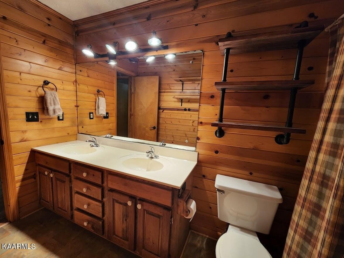 3390 Rocky Ridge Road Cosby, TN 37722 - Photo 18 of 45 a bathroom with a toilet sink and mirror