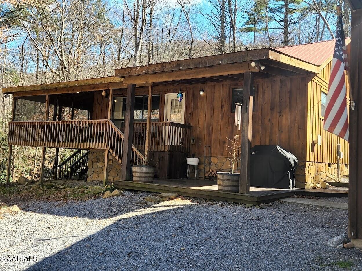 3390 Rocky Ridge Road Cosby, TN 37722 - Photo 2 of 45 a view of a house with a small yard and wooden fence