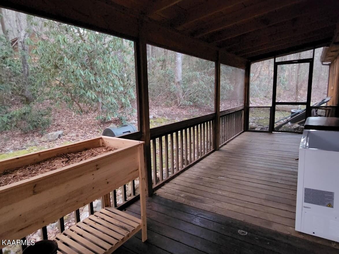 3390 Rocky Ridge Road Cosby, TN 37722 - Photo 25 of 45 a view of a balcony with wooden floor