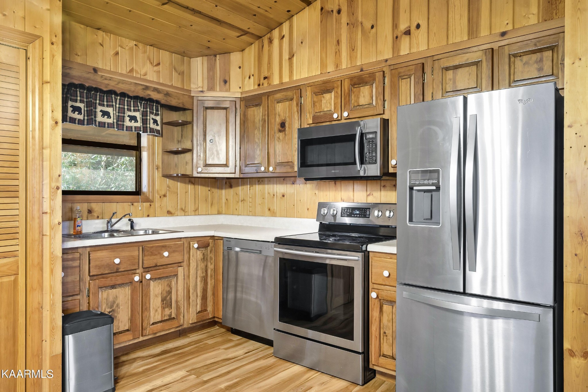 3390 Rocky Ridge Road Cosby, TN 37722 - Photo 35 of 45 a kitchen with stainless steel appliances granite countertop a refrigerator a stove a sink and a microwave