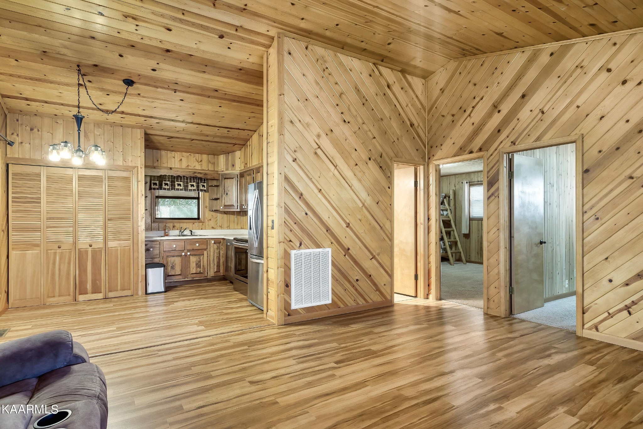 3390 Rocky Ridge Road Cosby, TN 37722 - Photo 37 of 45 a view of a hallway with wooden floor and staircase
