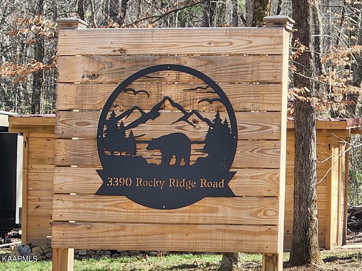 3390 Rocky Ridge Road Cosby, TN 37722 - Photo 4 of 45 a sign that is on the side of a building