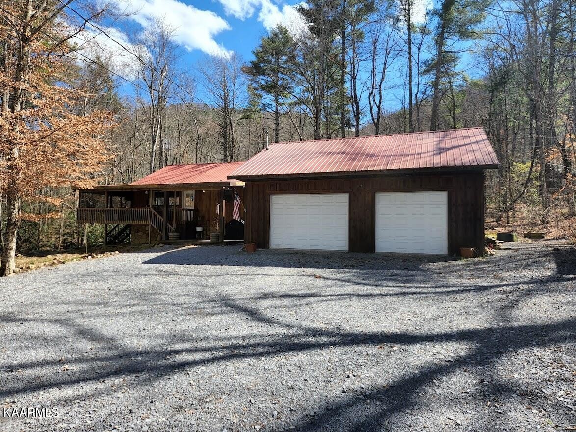 3390 Rocky Ridge Road Cosby, TN 37722 - Photo 5 of 45 a view of a house with a yard and tree s