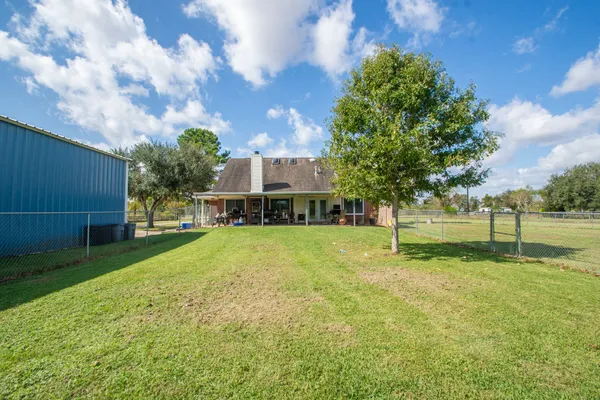 a view of a house with a big yard