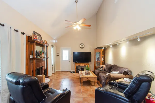 a living room with furniture and a flat screen tv
