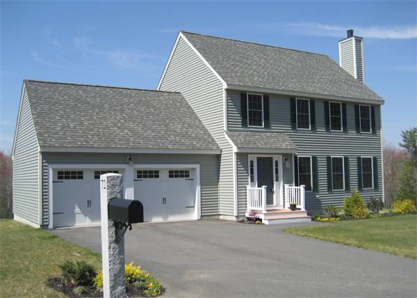 72 Snake Hill Road Ayer, MA 01432 - Photo 1 of 23 a front view of a house with a yard and garage