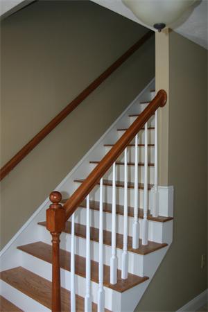 72 Snake Hill Road Ayer, MA 01432 - Photo 11 of 23 a view of a hallway with wooden floor and staircase