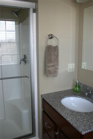 72 Snake Hill Road Ayer, MA 01432 - Photo 17 of 23 a bathroom with a granite countertop sink a mirror and shower