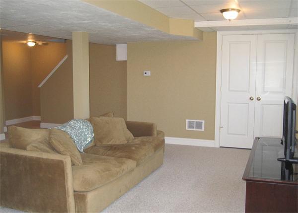 72 Snake Hill Road Ayer, MA 01432 - Photo 21 of 23 a living room with furniture and a flat screen tv
