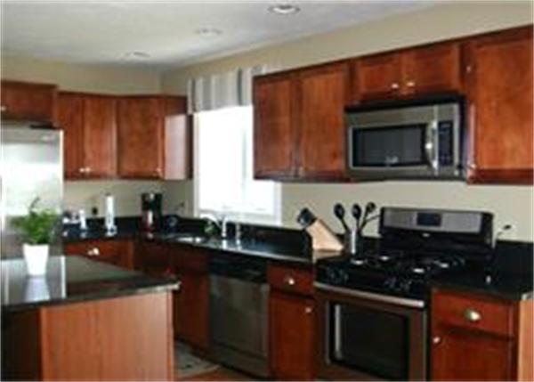 72 Snake Hill Road Ayer, MA 01432 - Photo 6 of 23 a kitchen with granite countertop a sink and cabinets