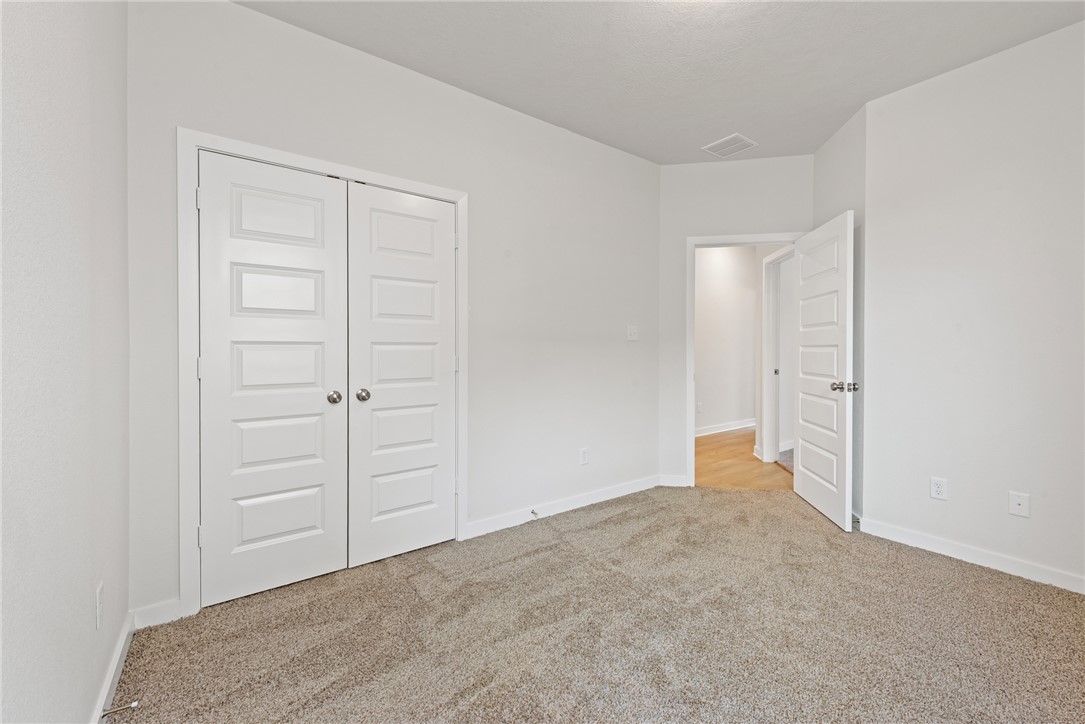 2412 Rooke Road Bryan, TX 77807 - Photo 30 of 35 a view of an empty room and closet area
