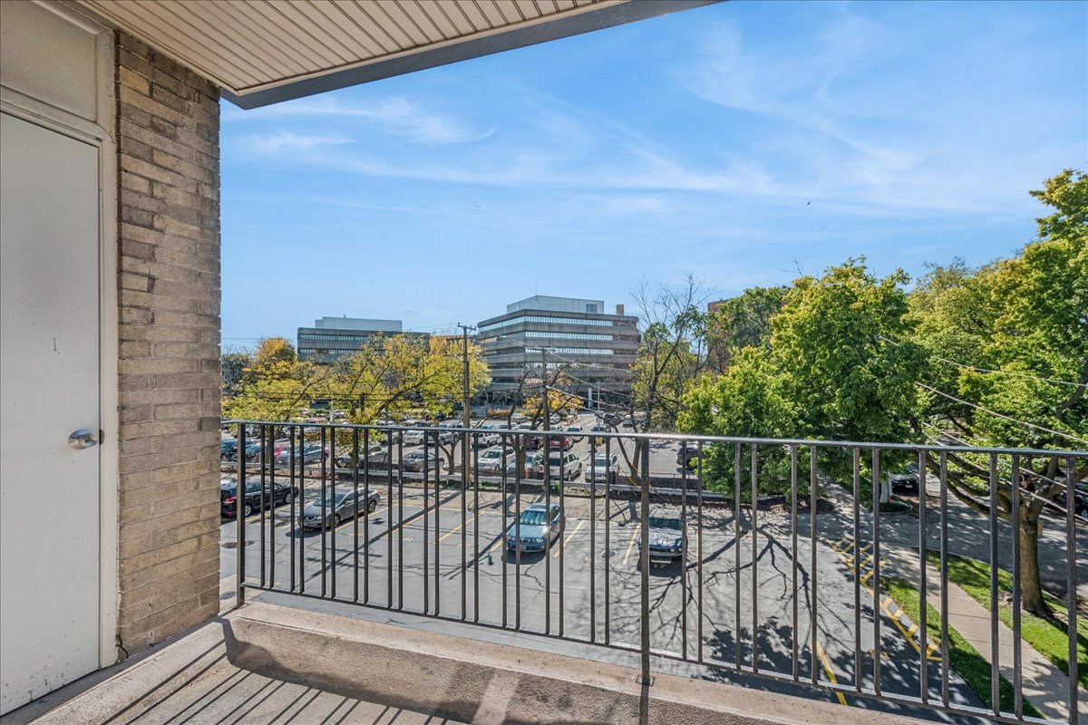 828 Oakton Street, Unit 3F Evanston, IL 60202 - Photo 5 of 21 a view of a balcony with a floor to ceiling window next to a building