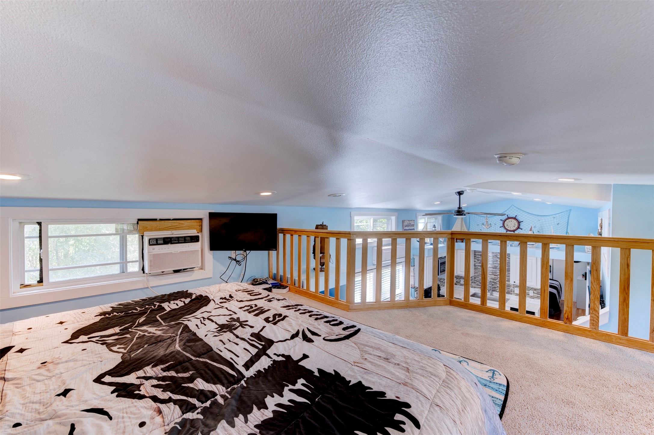 664 Jensen Drive Cleveland, TX 77327 - Photo 16 of 36 a bed sitting in a bedroom next to a window