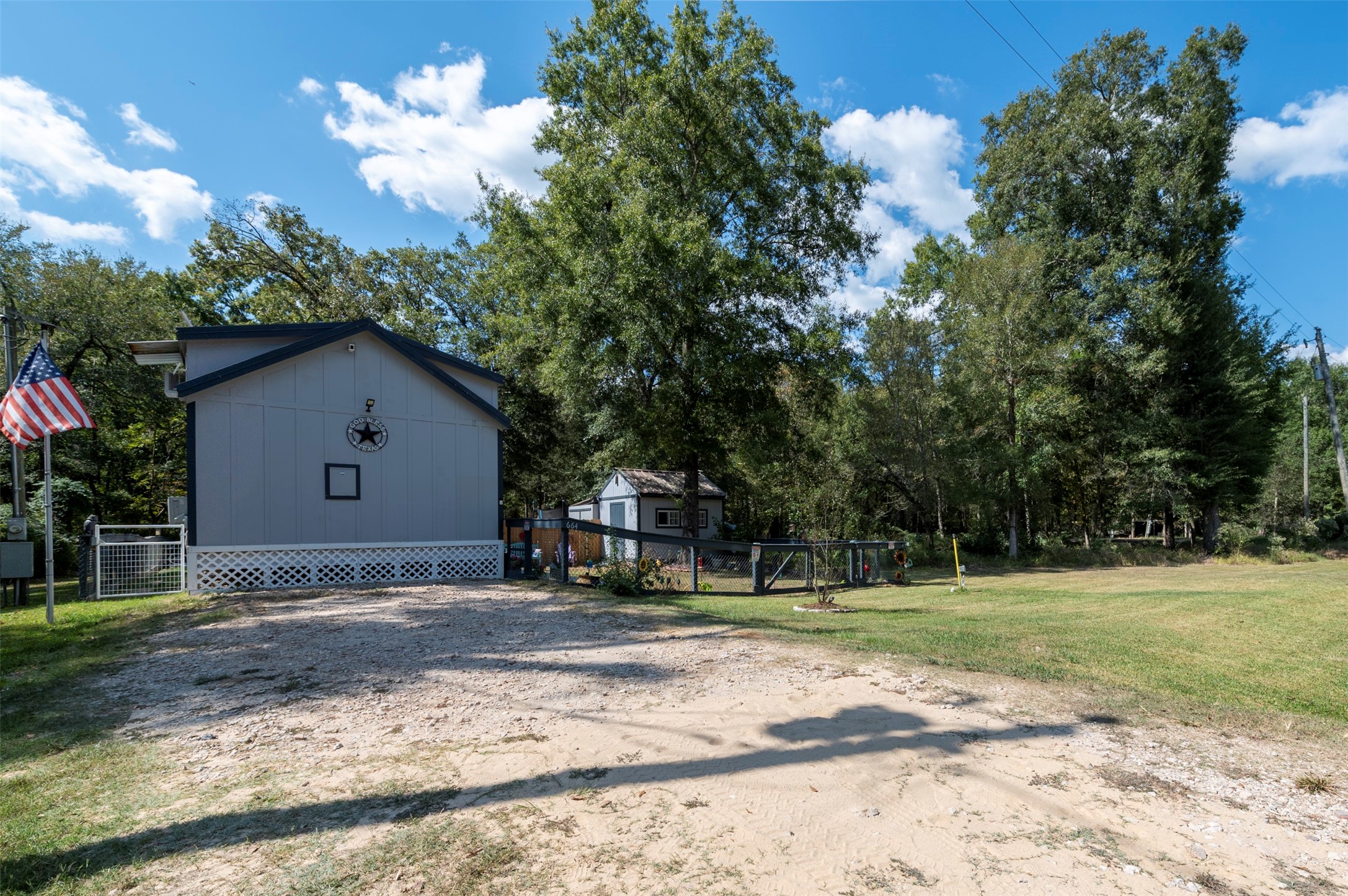664 Jensen Drive Cleveland, TX 77327 - Photo 29 of 36 a house with trees in the background