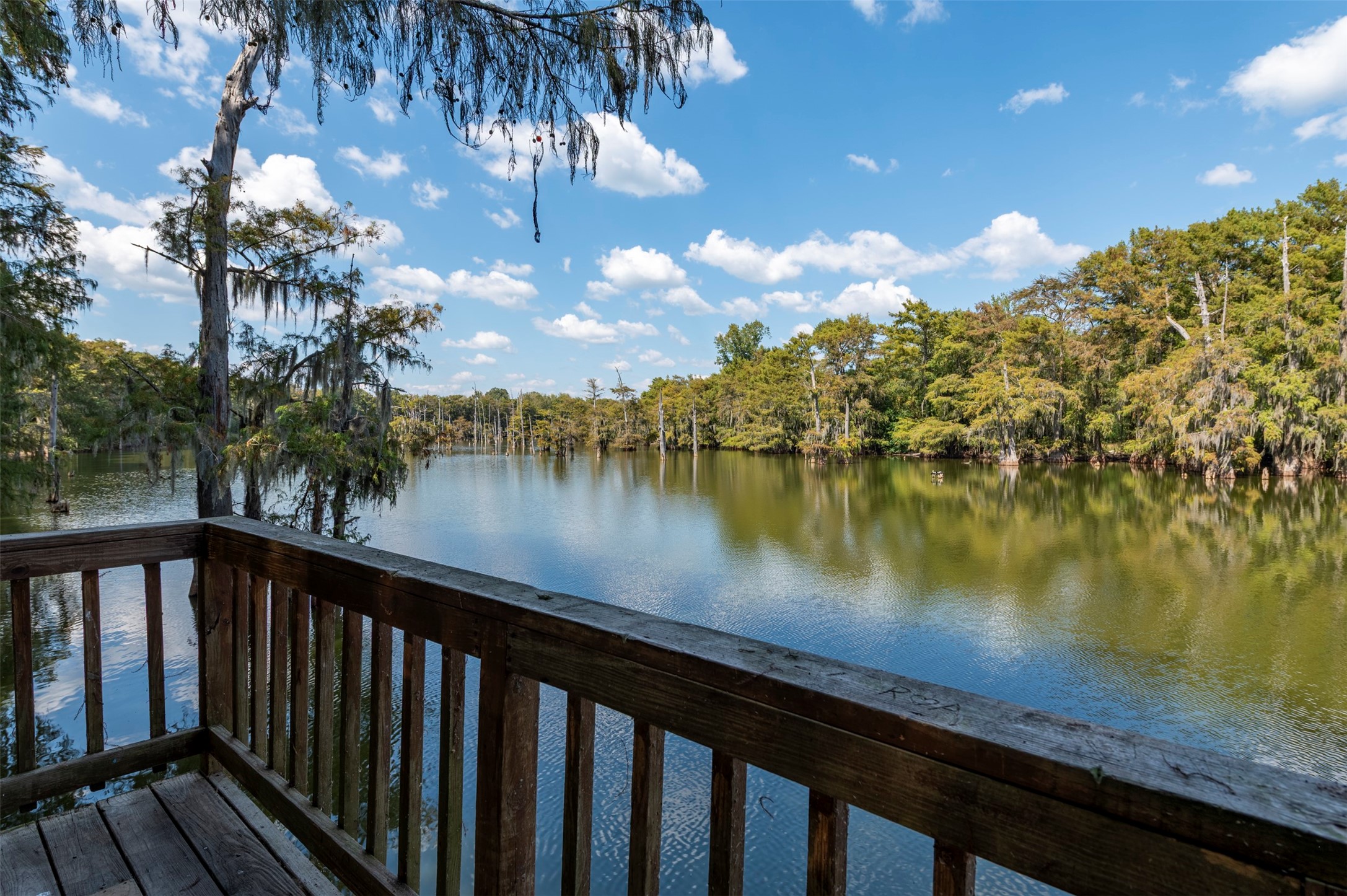 664 Jensen Drive Cleveland, TX 77327 - Photo 35 of 36 a view of a lake from a balcony