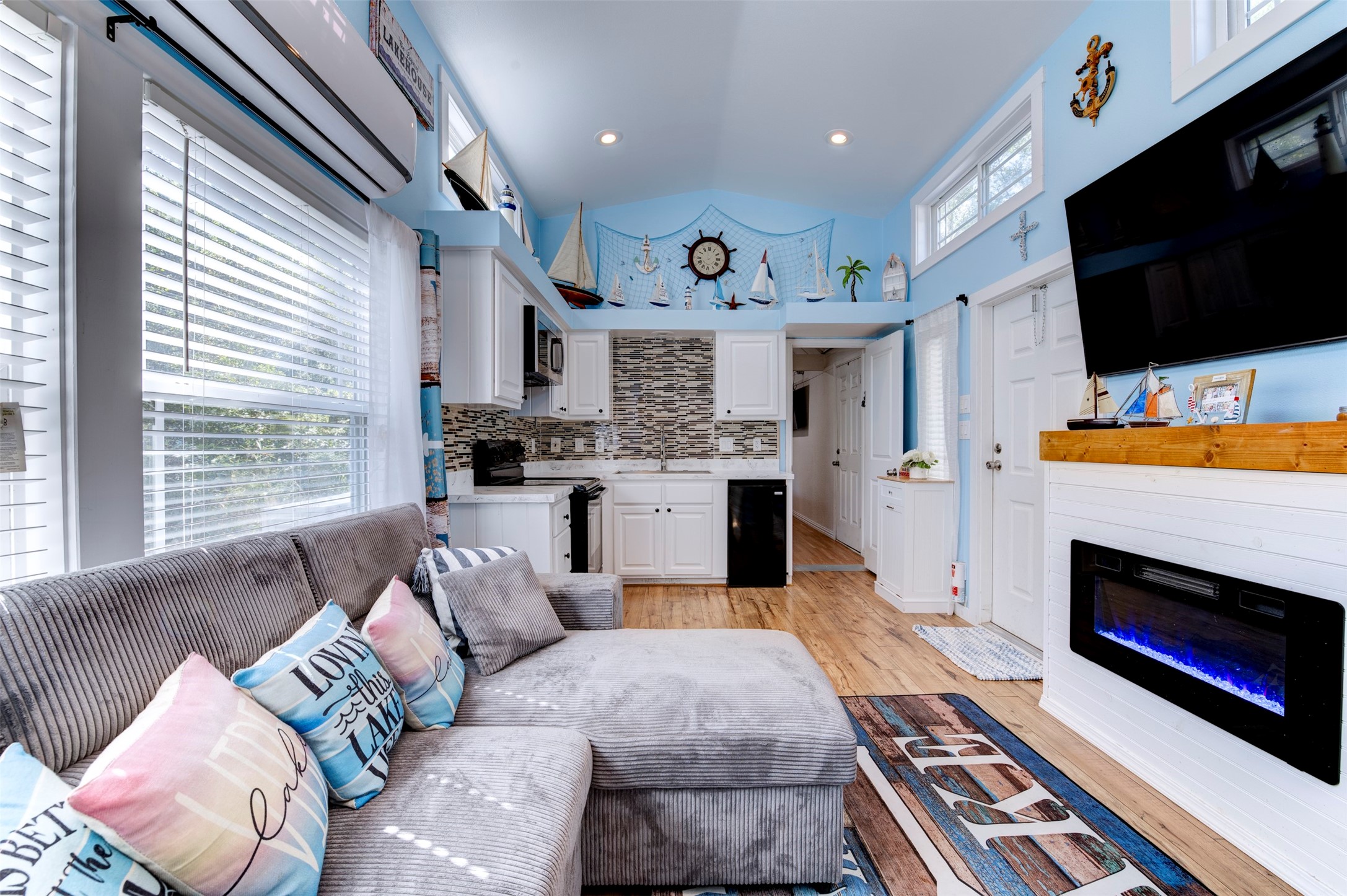 664 Jensen Drive Cleveland, TX 77327 - Photo 8 of 36 a living room with furniture fireplace and flat screen tv