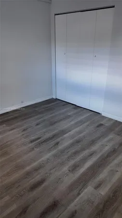 a bathroom with a shower and a mirror