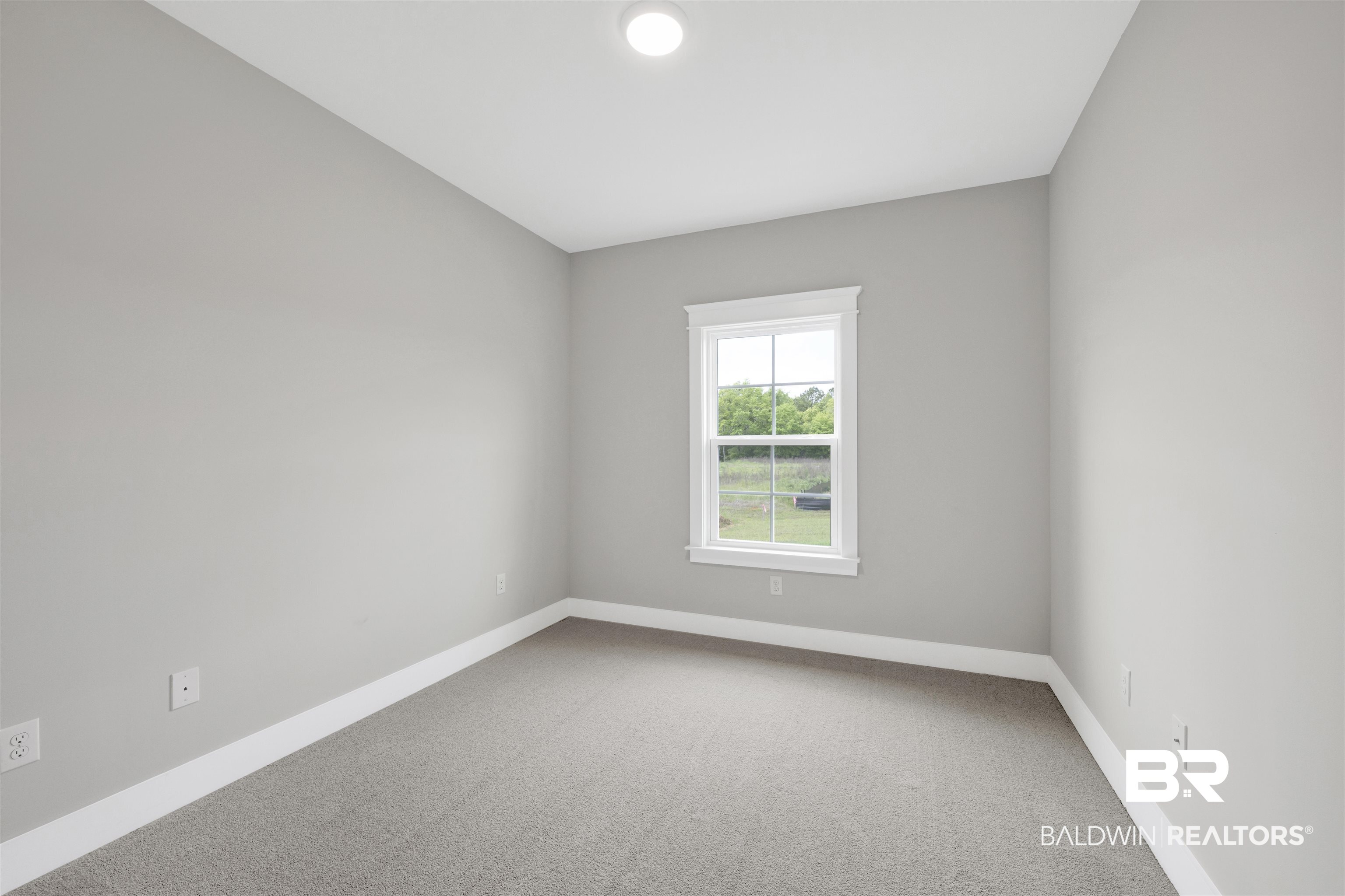 27315 Patch Pl Loop Daphne, AL 36526 - Photo 23 of 43 Empty room with light colored carpet and baseboards