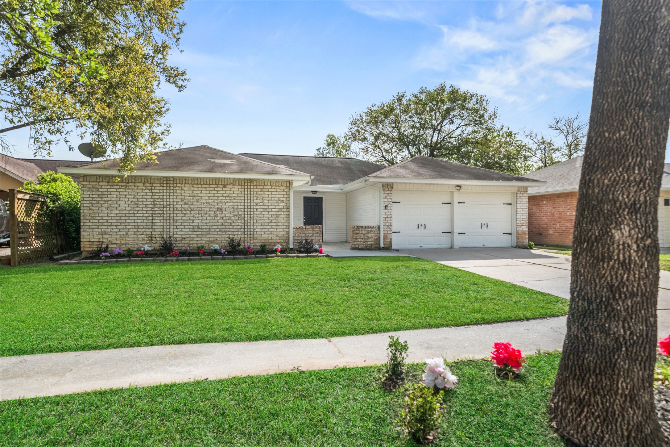a view of an house with backyard space and garden