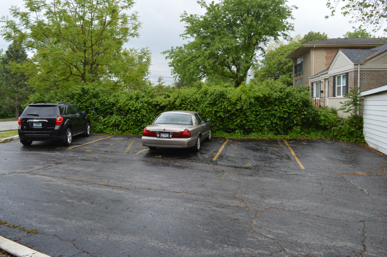 2025 Maple Road, Unit 1E Homewood, IL 60430 - Photo 11 of 12 a car parked in front of a house