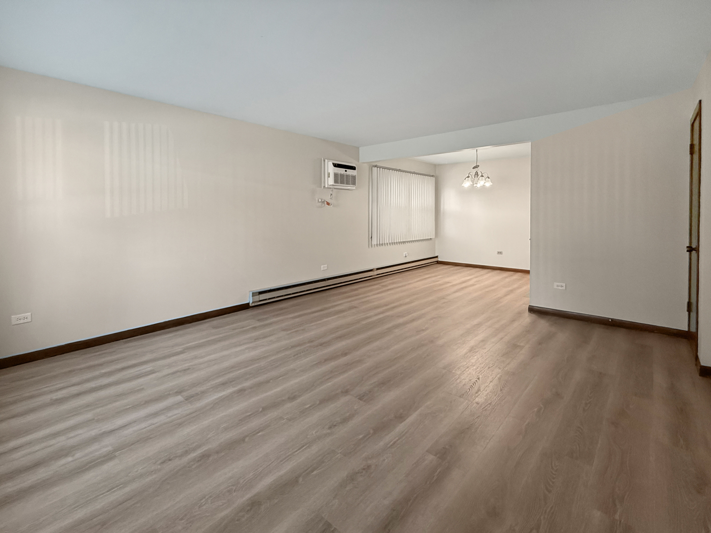 2025 Maple Road, Unit 1E Homewood, IL 60430 - Photo 2 of 12 a view of an empty room and wooden floor