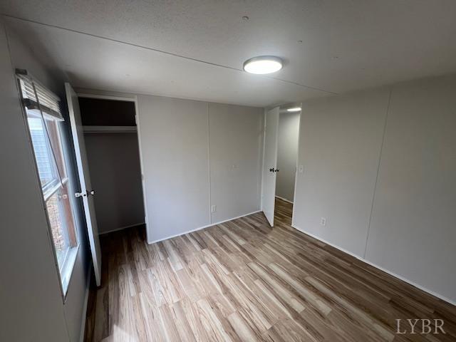 150 Stallion Court Amherst, VA 24521 - Photo 14 of 26 a view of empty room with wooden floor