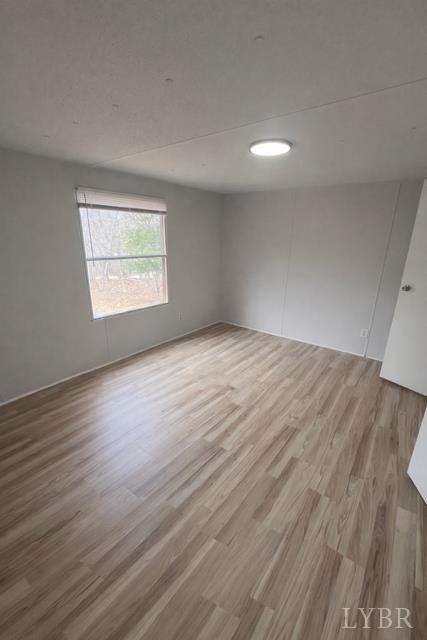 150 Stallion Court Amherst, VA 24521 - Photo 20 of 26 a view of an empty room with wooden floor and a window