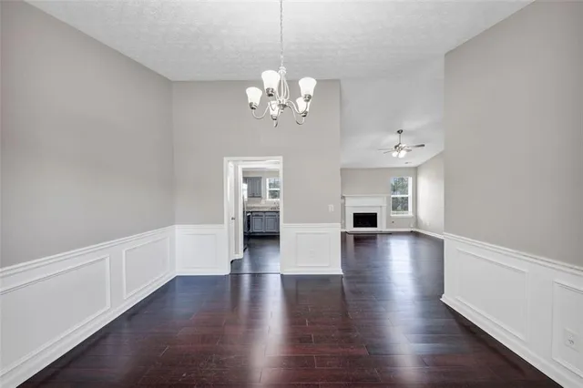 a kitchen with stainless steel appliances granite countertop a refrigerator stove and sink