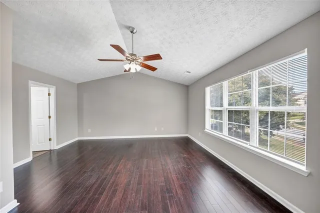 a kitchen with stainless steel appliances granite countertop wooden cabinets and a stove top oven