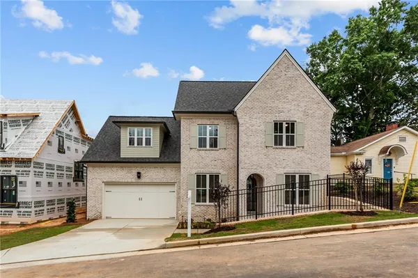 a front view of a house with a garage