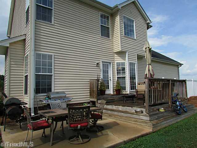 2585 Tuttle Road Walnut Cove, NC 27052 - Photo 4 of 16 Exterior Back. Enjoy entertaining on this patio & deck overlooking 2 acres!
