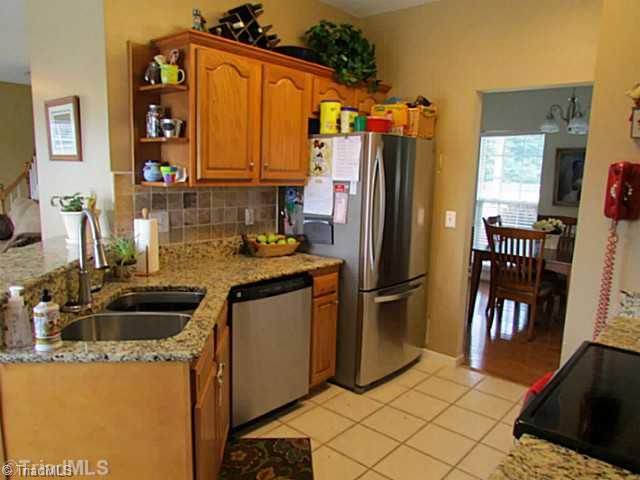 2585 Tuttle Road Walnut Cove, NC 27052 - Photo 9 of 16 Kitchen. Enjoy eat-in bar, granite,pantry, stainless appliances & more!