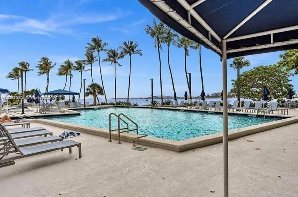 a view of swimming pool with chairs