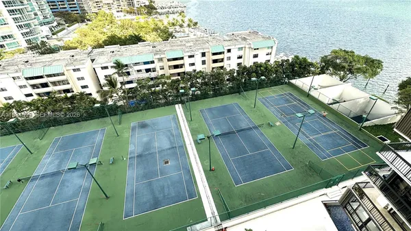 an aerial view of multiple houses with yard