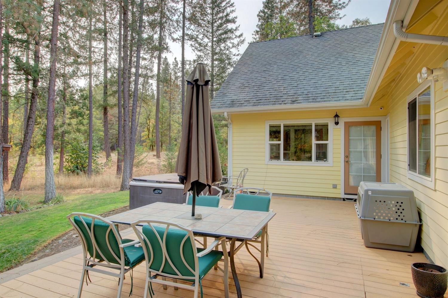 1065 Riessen Road Grants Pass, OR 97526 - Photo 27 of 32 a view of a house with backyard and sitting area
