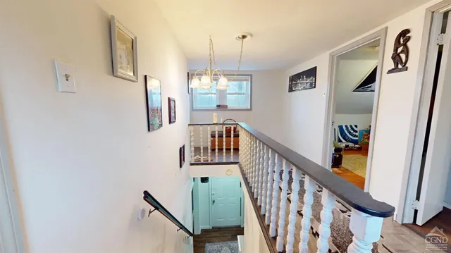 a view of an entryway with wooden floor