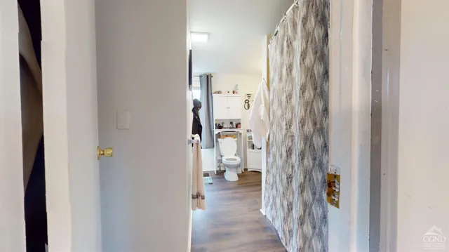 a view of a bathroom from a hallway