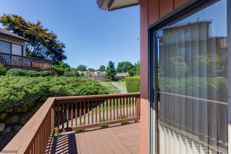 250 South Ridgedale Avenue, Unit 4 Florham Park, NJ 07932 - Photo 15 of 15 a view of balcony with wooden floor and fence