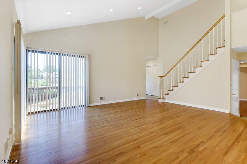 250 South Ridgedale Avenue, Unit 4 Florham Park, NJ 07932 - Photo 2 of 15 a view of empty room with wooden floor and fan