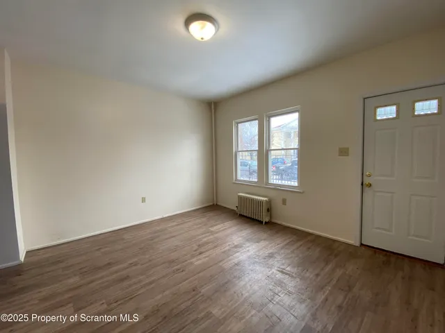 a white refrigerator freezer and a table in a room